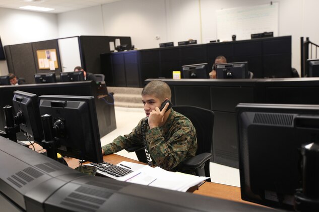 Help desk representatives assist callers computer issues at a new complex containing the Marine Air Ground Task Force Information Technology Support Center, known as MITSC or the MAGTF IT Support Center, aboard Marine Corps Base Camp Lejeune Jan. 7. Civilians and Marines alike work at the facilities.