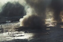 An explosive charge set by Marines with Bridge Company, 8th Engineer Support Battalion, 2nd Marine Logistics Group detonates at a training range aboard Camp Lejeune, N.C., Jan. 18, 2013. Similar explosions erupted throughout the range as combat engineers with the company trained to breach obstacles they might encounter in the field.