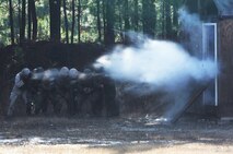 A breaching team with Bridge Company, 8th Engineer Support Battalion, 2nd Marine Logistics Group blows through a door during the unit’s urban breaching and demolition training aboard Camp Lejeune, N.C., Jan. 18, 2013. Teams of Marines used specially designed charges to breach doors, windows and walls. 
