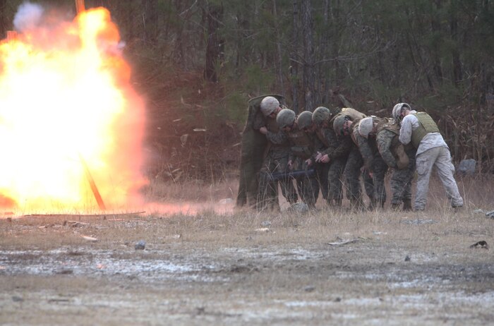 A breaching team with Bridge Company, 8th Engineer Support Battalion, 2nd Marine Logistics Group destroys a door during the unit’s urban breaching and demolition exercise aboard Camp Lejeune, N.C., Jan. 18, 2013. The Marines used the exercise to broaden their knowledge of military demolitions and gain first-hand experience with breaching operations. 