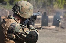 Lance Cpl. Brandon T. Rowland, a native of Warren, Ohio, and combat engineer with Bridge Company, 8th Engineer Support Battalion, 2nd Marine Logistics Group, recoils after firing the M-1014 Joint Service Combat Shotgun at a range aboard Camp Lejeune, N.C., Jan. 18, 2013. Rowland later used the shotgun to blast through door locks. 