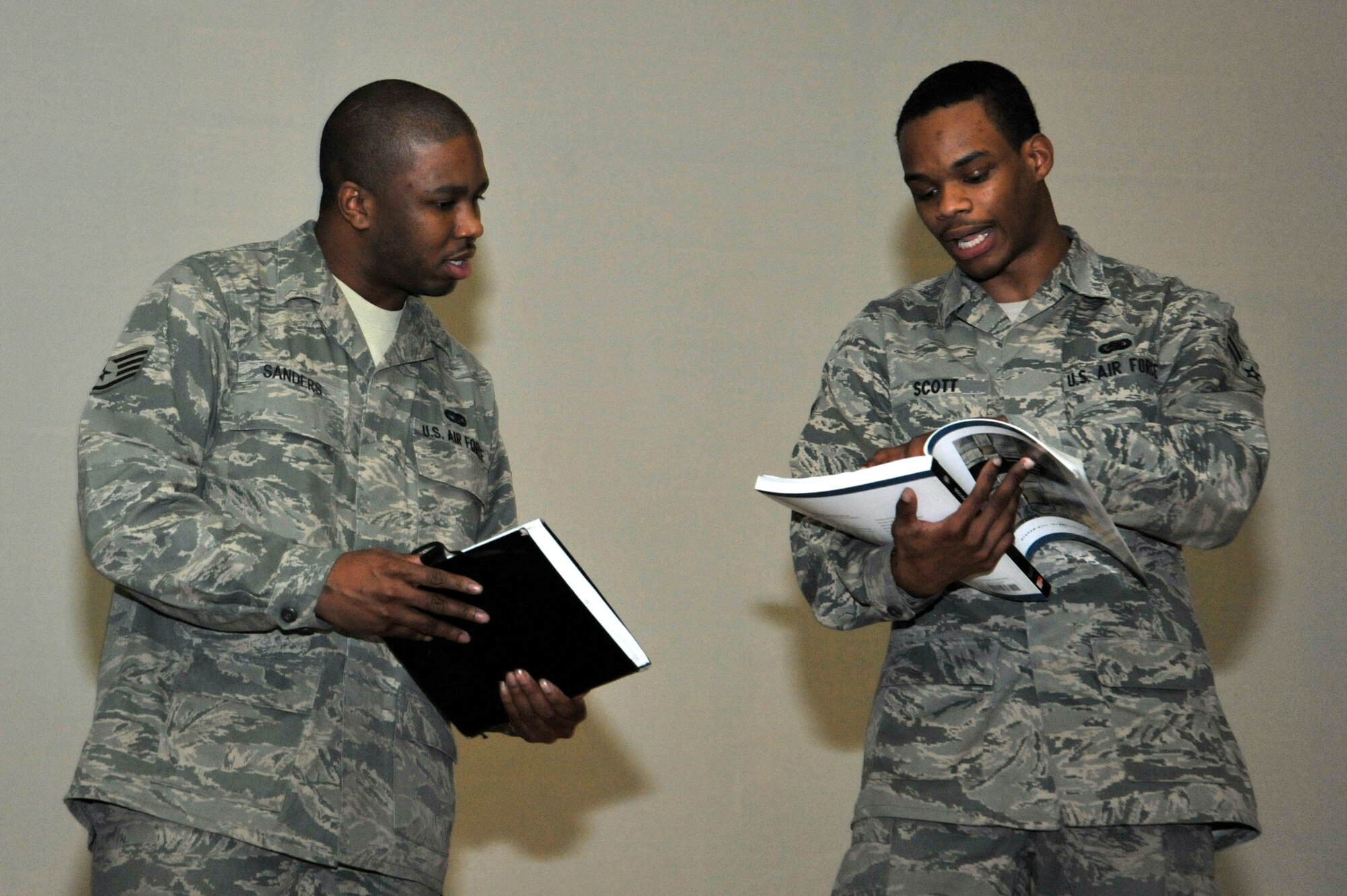 Staff Sgt. Mark Sanders (left), 51st Logistics Readiness Squadron vehicle operator and dispatcher, and Airman 1st Class Nigel Scott, 51st Logistics Readiness Squadron supply technician, act out a skit for the Dr. Martin Luther King Jr. Special Birthday Observance at the base theater on Osan Air Base, Republic of Korea, Jan. 23 2013.  Sanders and Scott’s skit highlighted the importance of Dr. King in American history.  (U.S. Air Force photo/Staff Sgt. Emerson Nuñez)