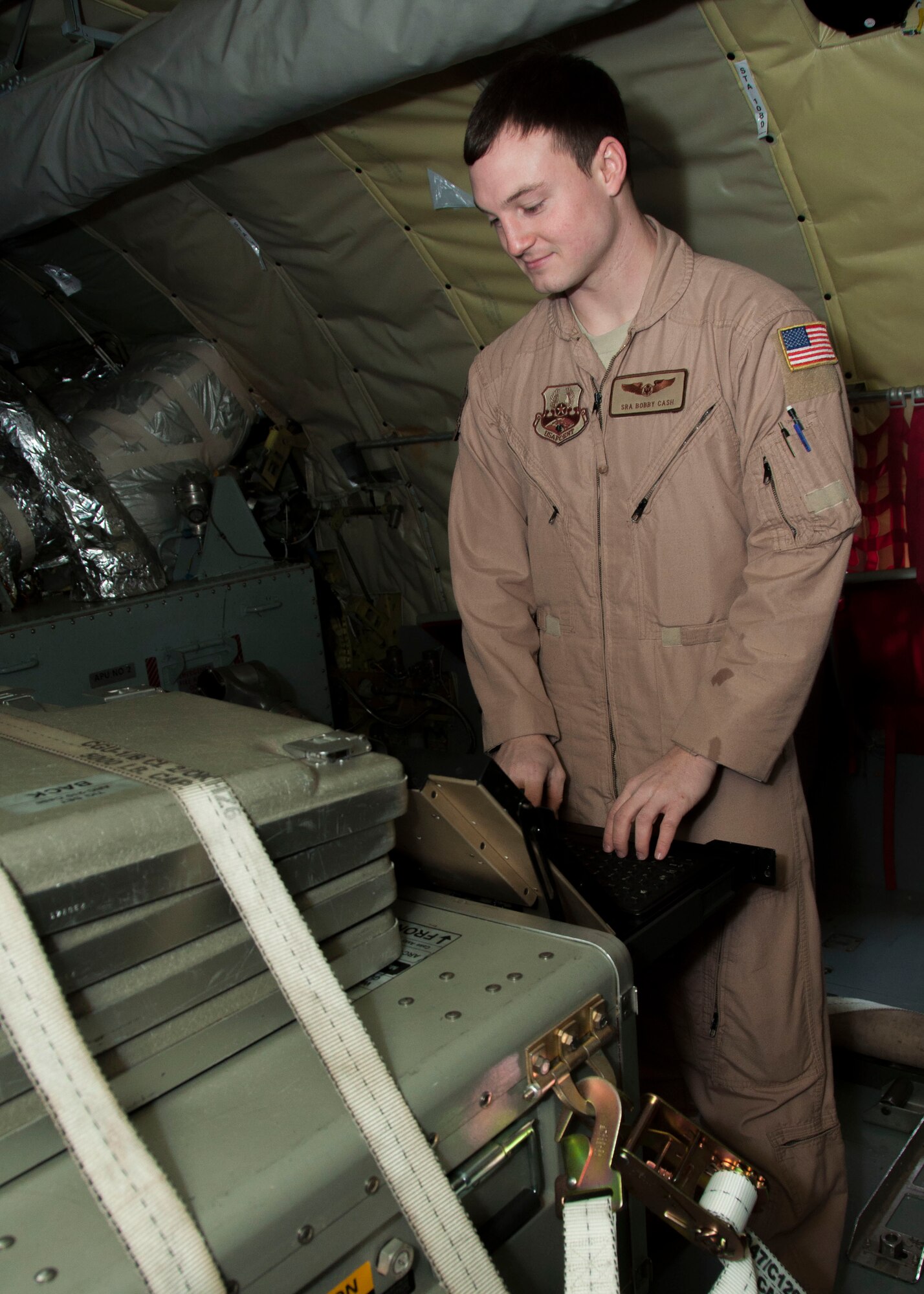 Senior Airman Bobby Cash, 22nd Expeditionary Air Refueling Squadron boom operator, monitors the Roll-On Beyond Line of Sight Enhancement, or ROBE, data link system aboard a KC-135 Stratotanker at Transit Center at Manas, Kyrgyzstan, Jan. 12, 2013. Boom operators are responsible for running the ROBE command and control system, and have maintained a 100 percent operation success rate so far in 2013. Cash is deployed from MacDill Air Force Base, Fla., and is a native of Swansea, S.C. (U.S. Air Force photo/Tech. Sgt. Rachel Martinez)