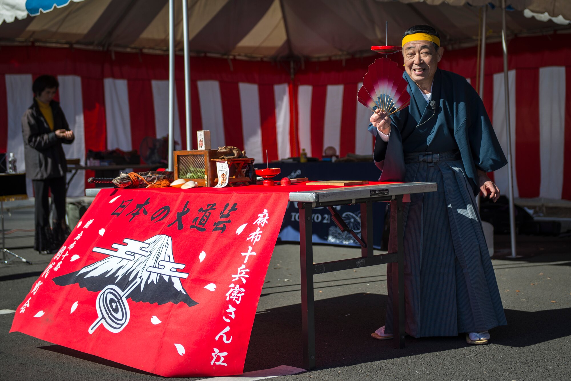 YOKOTA AIR BASE, Japan -- A performer entertains base residents with a traditional top demonstration during the Japanese Welfare Association Japan Culture Day Jan. 18, 2013, at Yokota Air Base, Japan. Approximately 400 people attended the event, which was designed to promote cultural exchange between Yokota’s Japanese employees and base residents. (U.S. Air Force photo by Capt. Raymond Geoffroy)