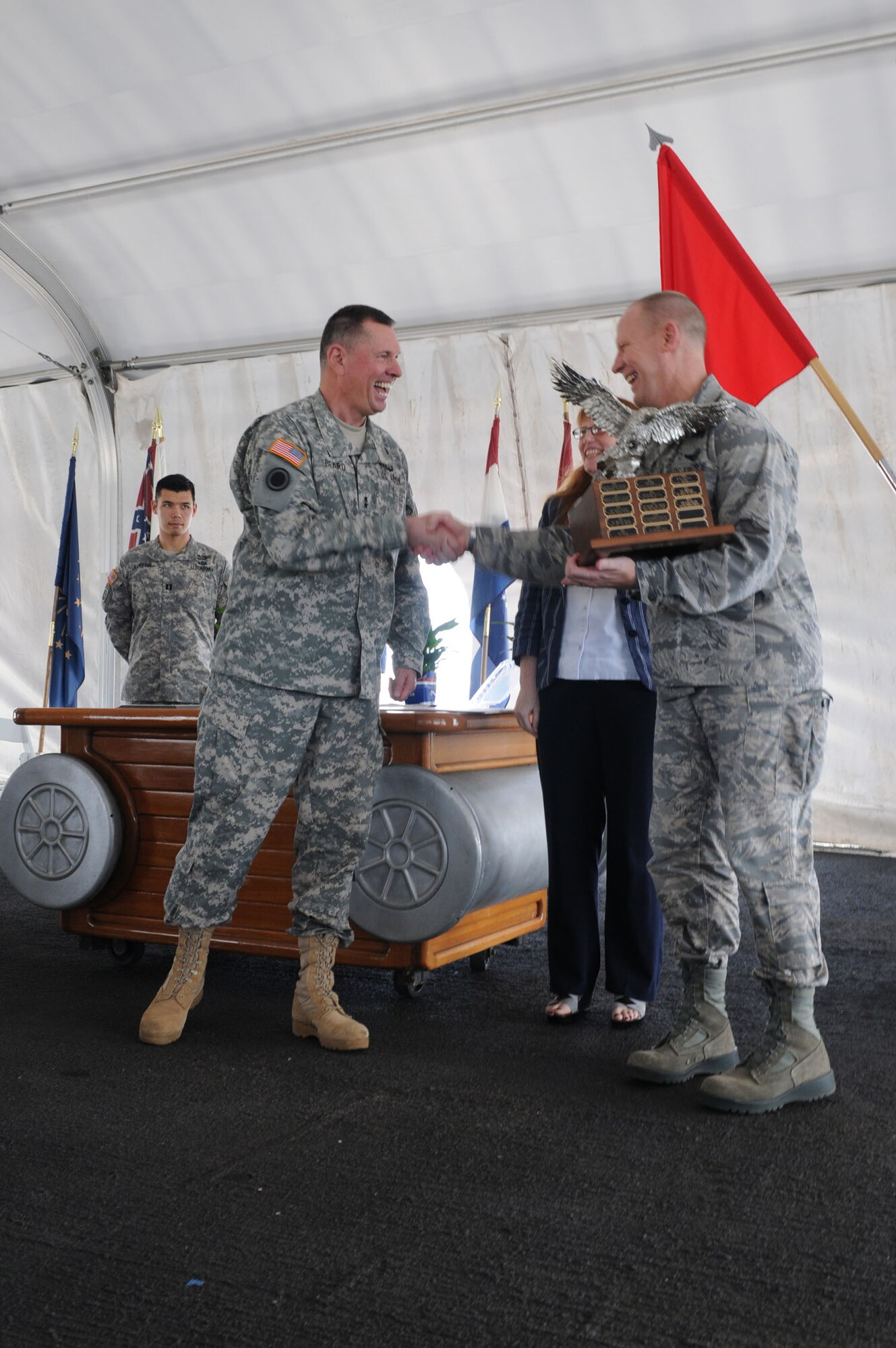 Maj. Gen. William Beard, U.S. Army Pacific deputy commanding general, presents a trophy to Brig. Gen. Patrick C. Malackowski, Pacific Air Forces director of programs, analyses, and lessons learned, during the 2012 Hawaii-Pacific Combined Federal Campaign Recognition Ceremony aboard the USS Missouri, Jan. 16, 2013.  The mission of the campaign is to promote and support philanthropy through a program that is employee focused, cost-efficient, and effective in providing all federal employees the opportunity to improve the quality of life for all. (U.S. Army photo/Staff Sgt. Amber Robinson)