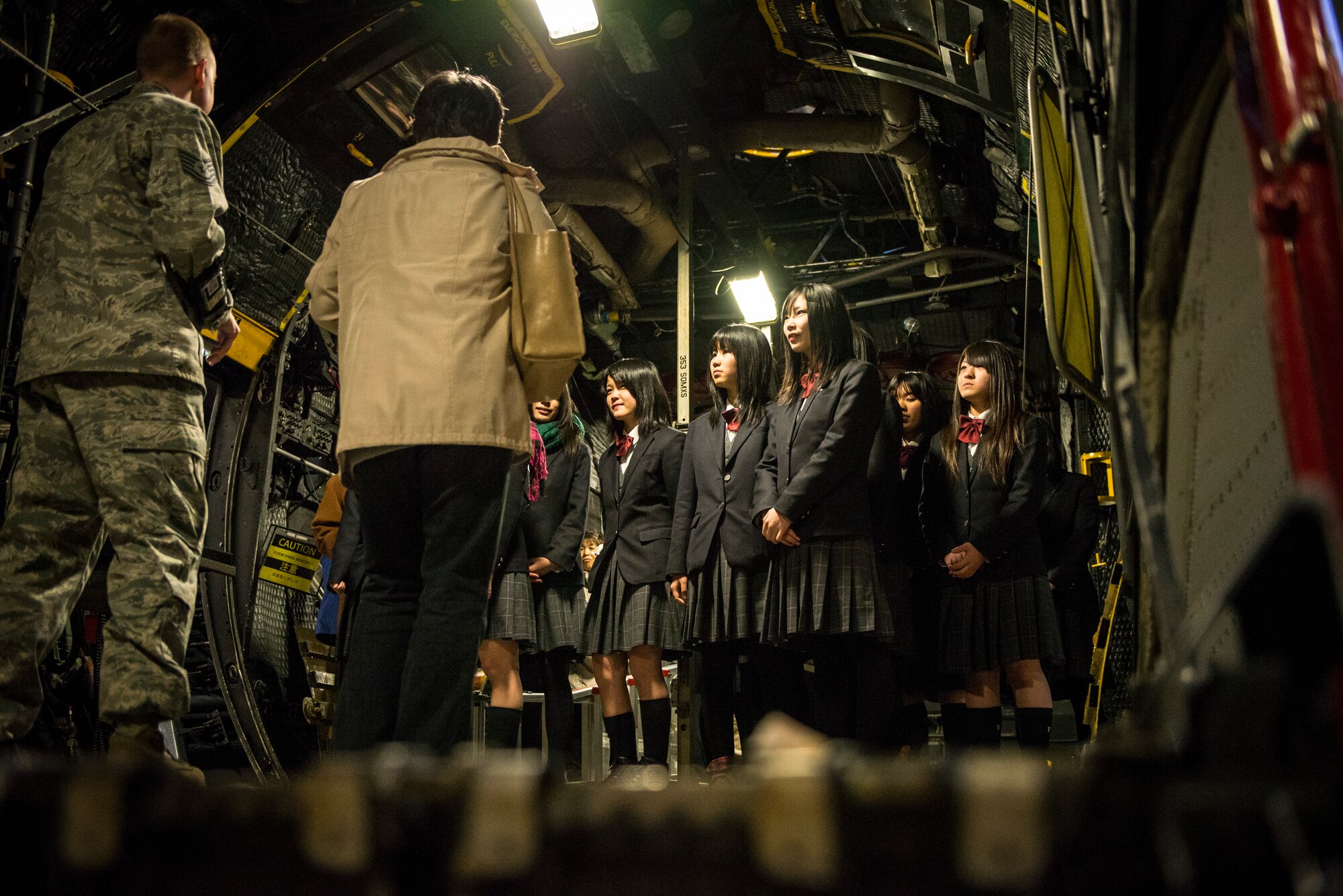 High school students from Japan’s Toyama Prefecture receive a briefing on aircraft maintenance aboard a U.S. Air Force MC-130 Combat Shadow II while visiting the 374th Maintenance Squadron isochronal dock during a tour Jan. 19, 2013, at Yokota Air Base, Japan. During the visit, Yokota maintainers gave the students a chance to learn about U.S. military aircraft and their mission. (U.S. Air Force photo by Capt. Raymond Geoffroy)