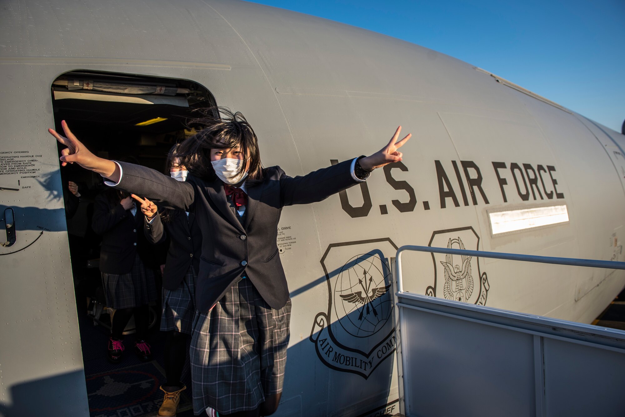 A high school student from Japan’s Toyama Prefecture exits a U.S. Air Force KC-10 Extender during a tour Jan. 19, 2013, at Yokota Air Base, Japan. Students toured Yokota as a part of a school trip to Akishima, a city neighboring the base. This was the students’ first opportunity to visit a U.S. air base and see military aircraft up close. (U.S. Air Force photo by Capt. Raymond Geoffroy)