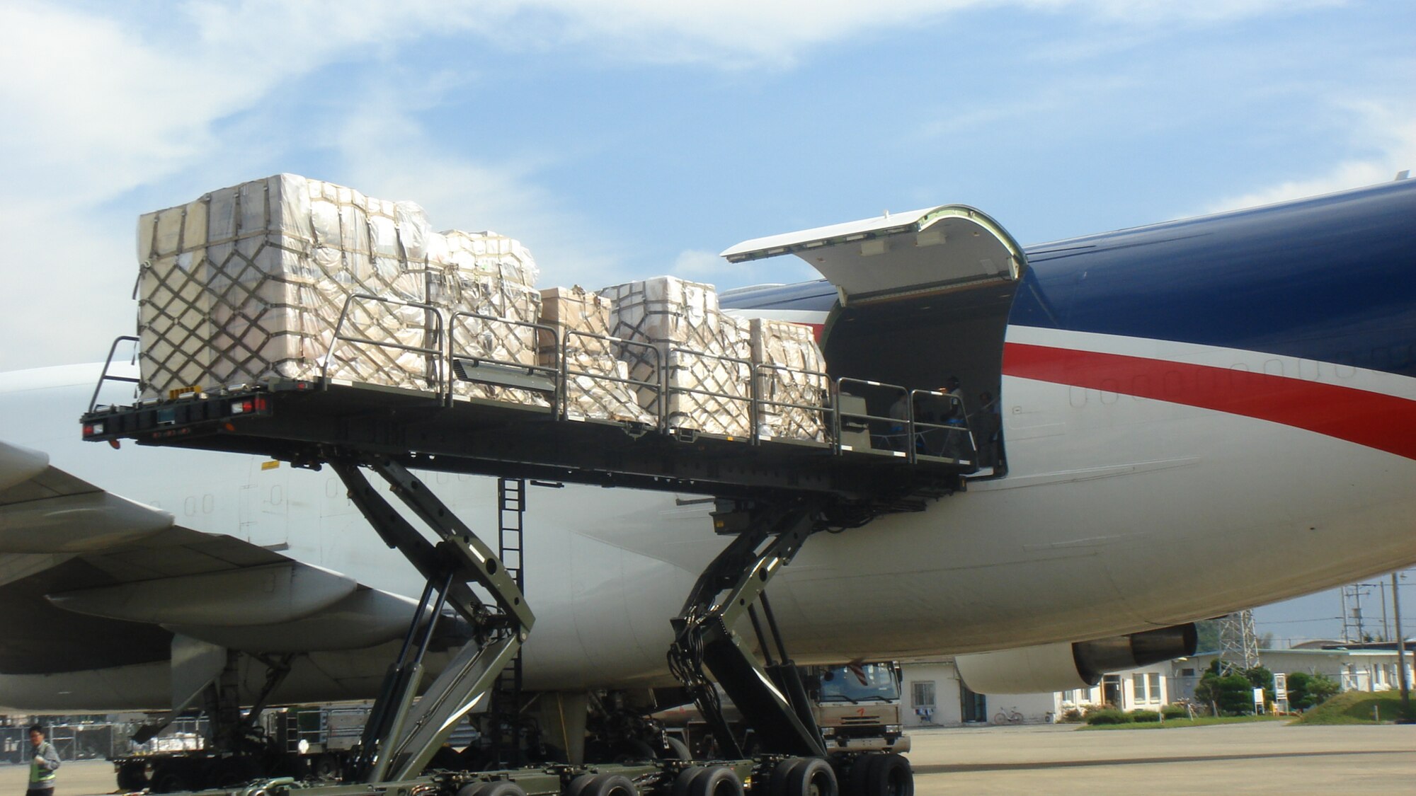 Cargo gets loaded into an aircraft on the flight line by members of the 731st Air Mobility Squadron at Osan Air Base, Republic of Korea. Even with the recent runway construction, the 731st AMS, teamed with both the Republic of Korea Air Force and sister units within U.S. Forces in Korea, were able to move operations to alternate locations and complete the mission. (courtesy photo) 