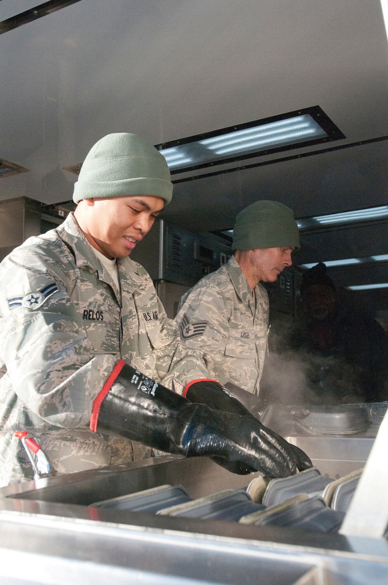 Members of the Kentucky Air National Guard’s 123rd Force Support Squadron cook meals for deployed Soldiers and Airmen at McKinley Technology High School in Washington, D.C., on Jan. 19, 2013. The Kentucky team served more than 1,800 meals from a Disaster Relief Mobile Kitchen Trailer. (Kentucky Air National Guard photo by Senior Airman Vicky Spesard)