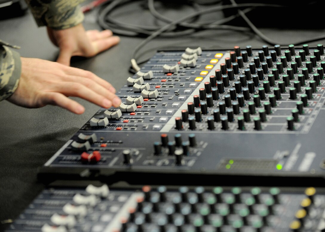 Senior Airman Jeffrey Davis, 744th Communications Squadron radio frequency technician, adjusts the audio during the Chief Master Sgt. of the Air Force (CMSAF) Transition rehearsal at Joint Base Andrews, Md., Jan. 23, 2013. Tomorrow, Chief Master Sgt. James A. Cody will become the 17th CMSAF following the retirement of Chief Master Sgt. James Roy. Roy's retirement will culminate more than 30 years of service. (U.S. Air Force photo/ Staff Sgt. Nichelle Anderson)