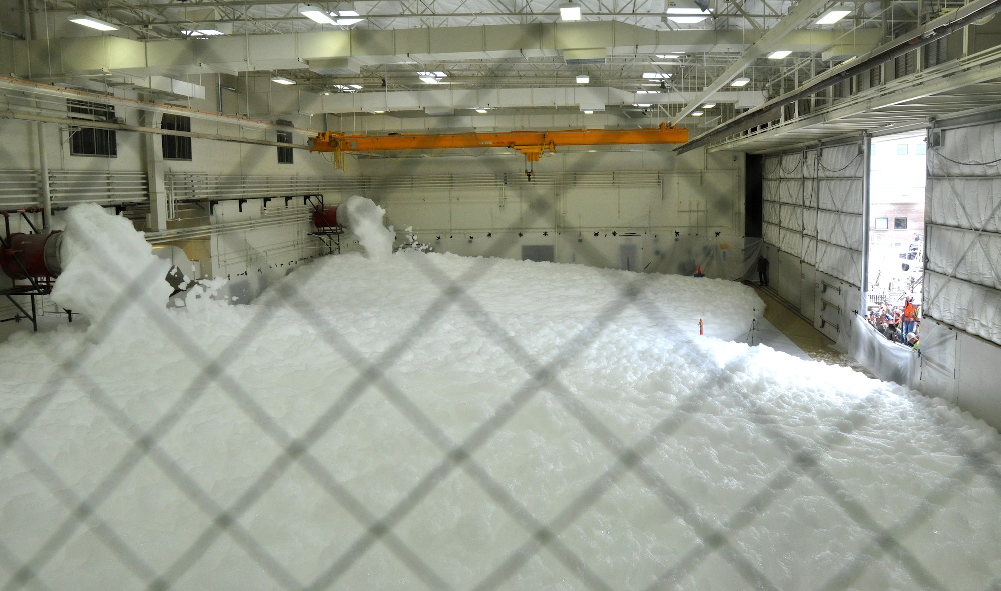 High Expansion Foam flooded the 943rd Maintenance Squadron hangar at Davis Monthan Air Force Base, Ariz. A test of the 943rd MXS fire suppression system was conducted on January, 23. The test ensured the fire suppression system was working properly prior to the 943rd MXS Airmen moving back into the hanger after it underwent major renovations for the past year.  (U.S. Air Force Photo/ Master Sgt. Luke Johnson)