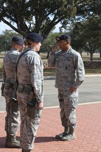 Capt. Antwan Floyd completes an entry control point check with Airmen from the 902nd Security Forces Squadron Jan. 23 at Joint Base San Antonio-Randolph. (U.S. Air Force photo by Joshua Rodriguez)