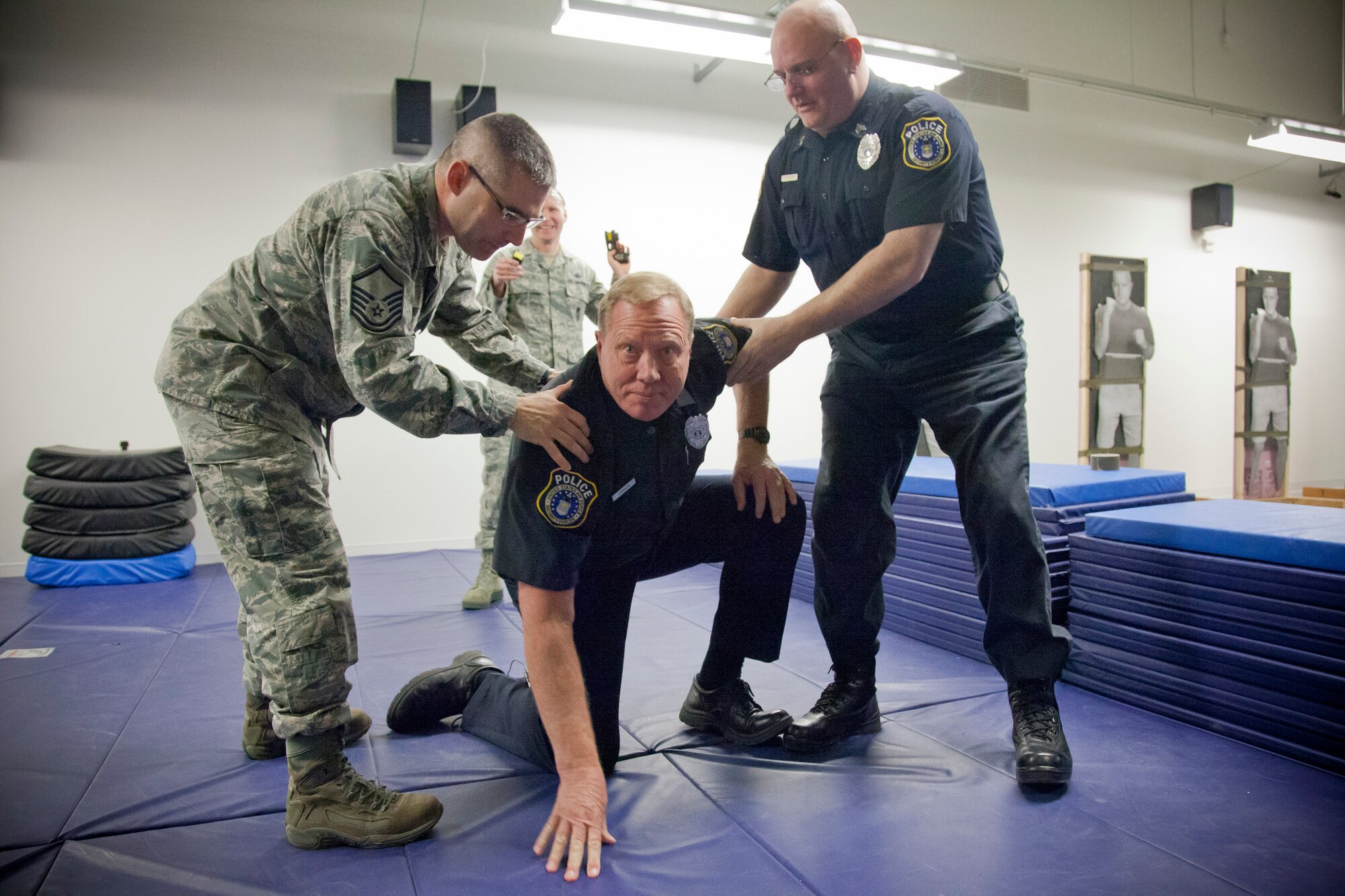 Officer Daniel Johnson, a Department of the Air Force Police Officer, is tased as part of a training course conducted by Master Sgt. Ronald Blackledge, 934th Security Forces, January 22.  The Taser equipment is set to be implemented in the coming month at the Minneapolis-St. Paul Air Reserve Station, Minn.  (U.S. Air Force Photo/Shannon McKay)