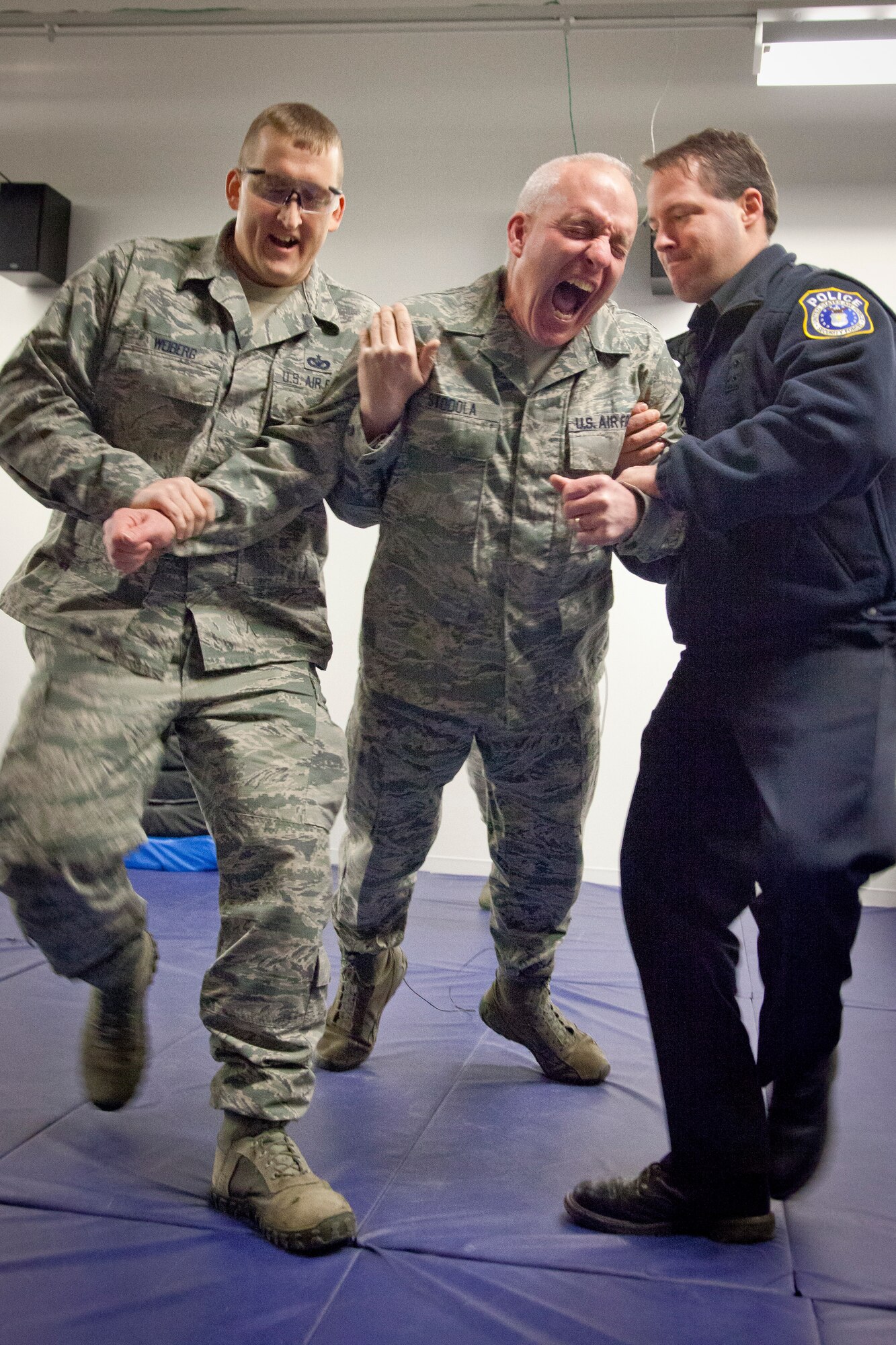 Seinior Master Sgt. Mark Stodola, 934th Security Forces Squadron, is tased as part of a training course conducted by Master Sgt. Ronald Blackledge January 22.  The Taser equipment is set to be implemented in the coming month at the Minneapolis-St. Paul Air Reserve Station, Minn.  (U.S. Air Force Photo/Shannon McKay)