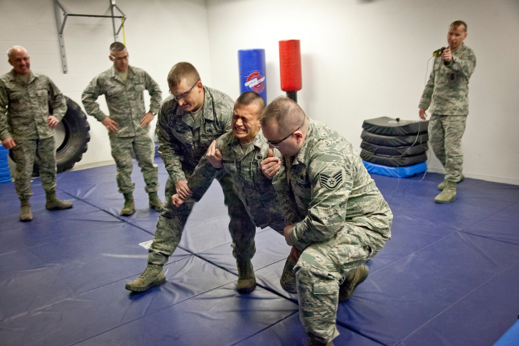 Senior Airman Joshua Cunningham, 934th Security Forces Squadron, is tased as part of a training course conducted by Master Sgt. Ronald Blackledge January 22.  The Taser equipment is set to be implemented in the coming month at the Minneapolis-St. Paul Air Reserve Station, Minn.  (U.S. Air Force Photo/Shannon McKay)