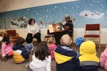 Library volunteer Felicia Ferdarko reads to preschool children from the Joint Base San Antonio-Randolph Child Development Center during Story Time Jan 16. at the JBSA-Randolph library.  Ferdarko read “Martin’s Big Words” by Doreen Rappaport to teach preschoolers about Dr. Martin Luther King Jr. and concepts of equality and nonviolence. (U.S. Air Force photo by Joshua Rodriguez)