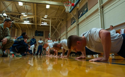 Airman Zachary Huffman, 628th Logistics Readiness Squadron fuels mobile equipment operator, squeezes out as many push-ups as he can during the Dorm Challenge Jan. 18, 2013, at Joint Base Charleston - Air Base, S.C. The quarterly Dorm Competition is a Wing initiative that is intended to encourage and incorporate all aspects of Comprehensive Airman Fitness, while also encouraging resident interaction and camaraderie. The Dorm Challenge consisted of push-ups, sit-ups and a game of dodgeball. (U.S. Air Force photo/Airman 1st Class Ashlee Galloway)