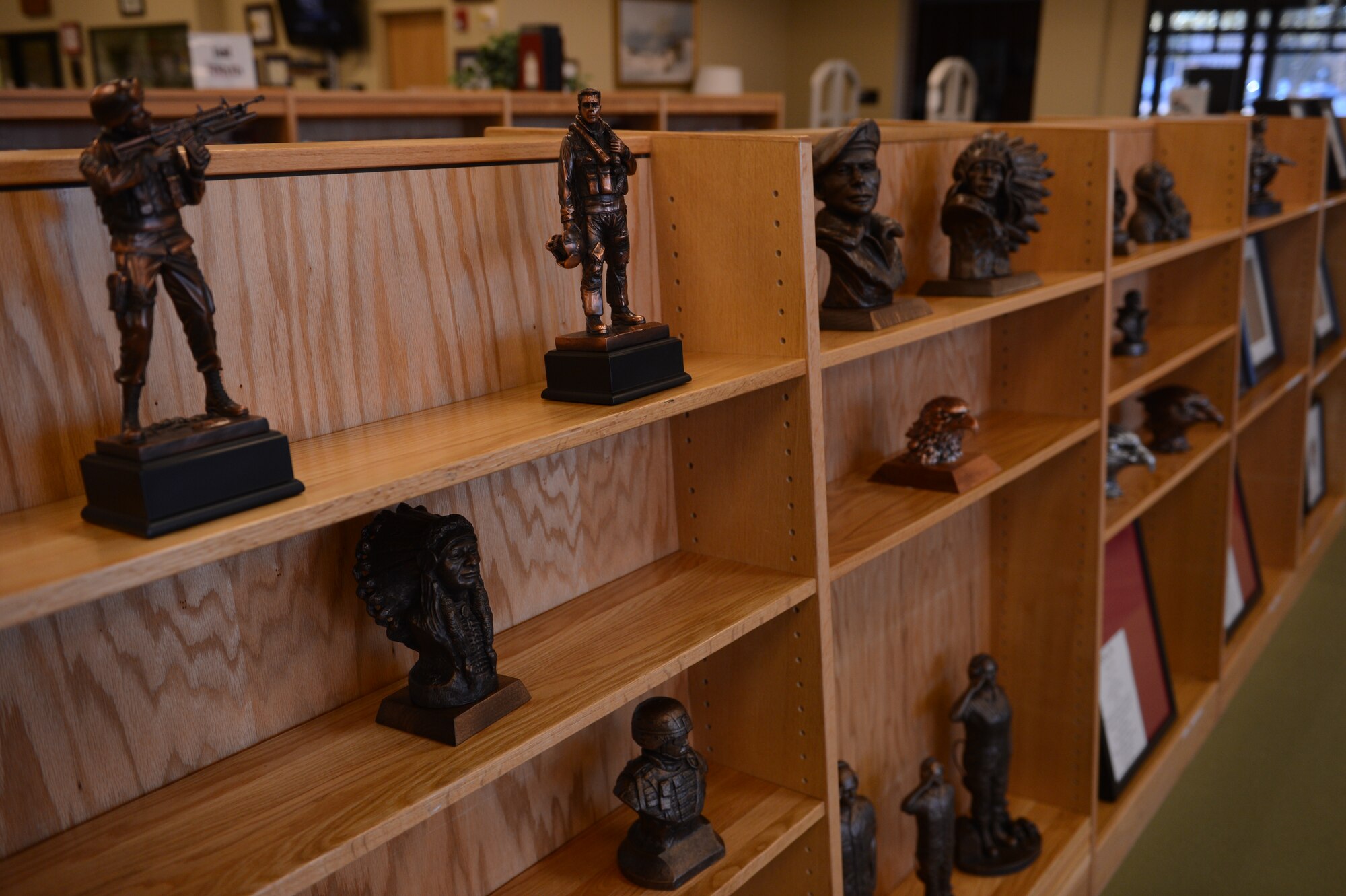 Awards and plaques for purchase are being moved to the McElveen Library, S.C., Jan. 22, 2013. The McElveen Library is scheduled to change to the McElveen Resource Center with the addition of new services, Feb. 1, 2013. The resource center will still offer internet research and Wi-Fi, traditional education resources, a multimedia center, group work stations and e-books and DVDs for checkout in addition to the new services. (U.S. Air Force photo by Airman 1st Class Krystal M. Jeffers/Released)