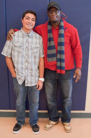 Angel Reynoso, Centennial High School student, and Davin Watson, youth center teen director, pose for a photo at the Nellis Air Force Base youth center Jan. 18. Reynoso was presented with the Nellis youth of the year award for his outstanding dedication to community service and for being a positive role model. (U.S. Air Force photo by Airman 1st Class Monet Villacorte)