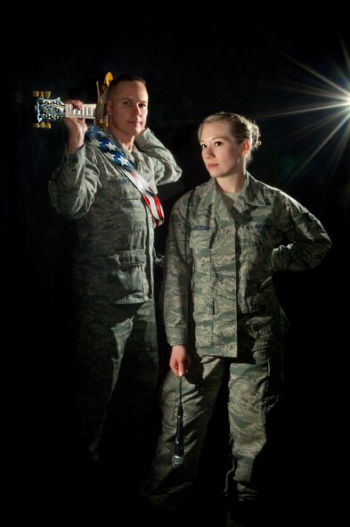 MINOT AIR FORCE BASE, N.D. -- Lt. Col. David Kunick, 5th Munitions Squadron commander and Staff Sgt. Heather Veldhouse, 5th Munitions Squadron pose for a photo here, Jan. 22. Kunick and Veldhouse are both members of RedBall, a local band comprised of 5th Bomb Wing-assigned members. The band boosts morale while providing a great outlet for stress. (U.S. Air Force photo/Tech. Sgt. Aaron Allmon)

