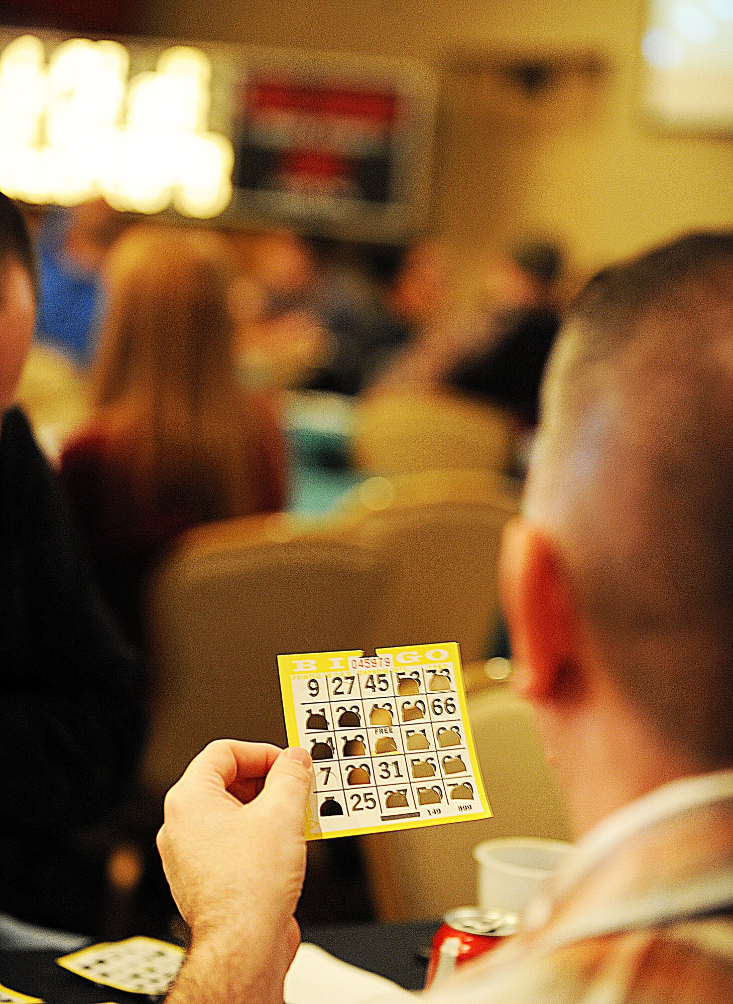 MINOT AIR FORCE BASE, N.D. -- An Airman participates in a game of bingo during the 48th Annual Team Minot Sportsmen Feed here, Jan. 20. As part of the feed, attendees had the opportunity to play bingo and darts, participate in a bean bag toss tournament and win raffle prizes donated by various downtown businesses. (U.S. Air Force photo/Senior Airman Jose L. Hernandez)