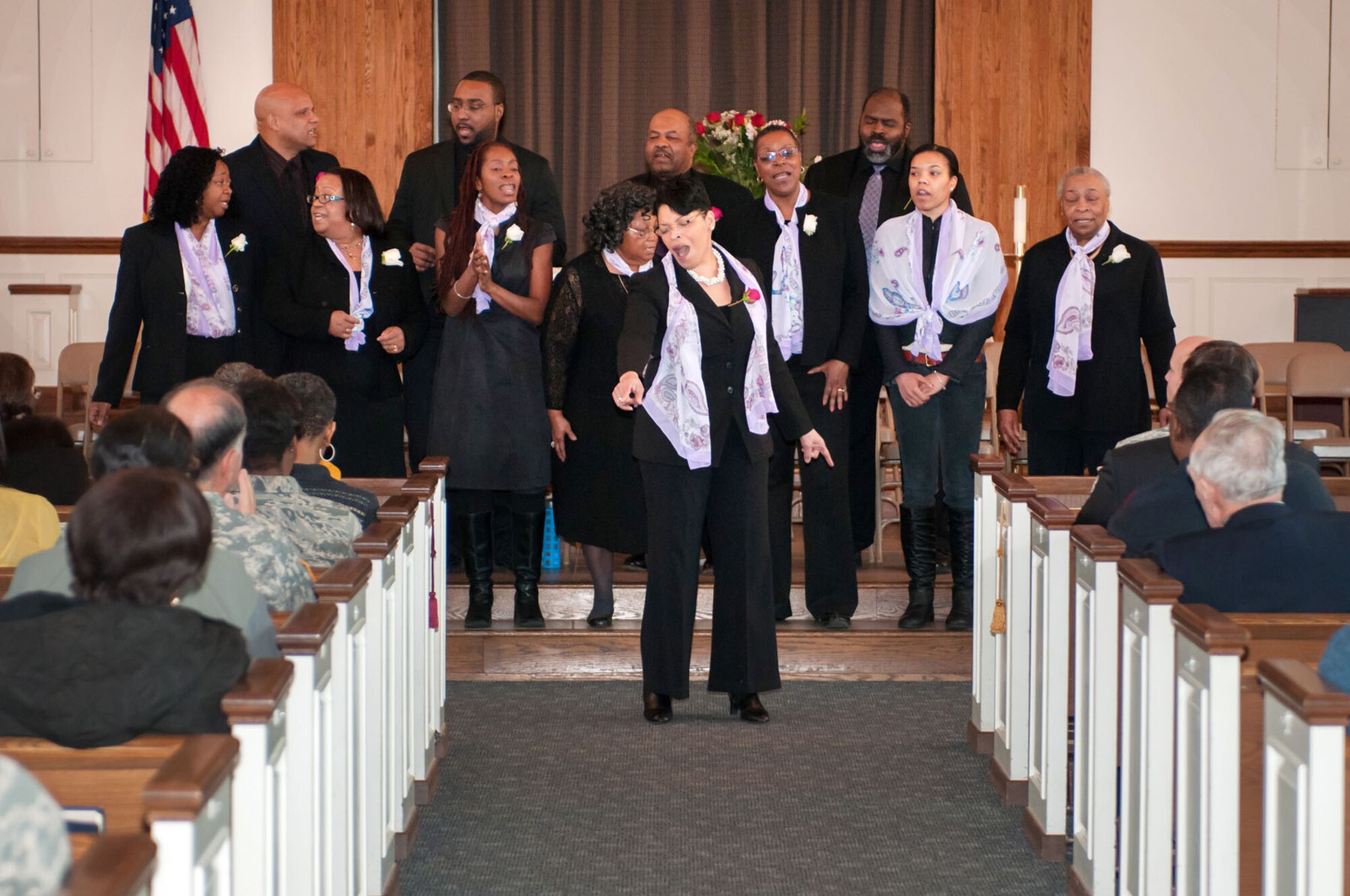 HANSCOM AIR FORCE BASE, Mass. – Attendees listen as Angelena Kyles (front) and other members of the acappella choir United Voices of New England, perform at the Dr. Martin Luther King Jr. birthday celebration at the base chapel Jan. 15. This year’s MLK observance focused on the theme “Remember! Celebrate! Act! A Mission Still to Fulfill.” (U.S. Air Force photo by Rick Berry)