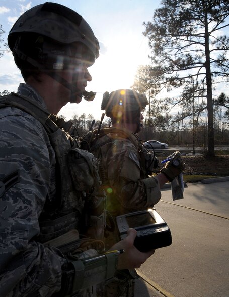 Airman 1st Class Michael Agemy, 19th Air Support Operations Squadron, Ft. Campbell, Ky., and Staff Sgt. Michael McAndrew, 9th Air Support Operations Squadron, Ft. Hood, Texas, assess their current location during Green Flag East 13-03 in Leesville, La., Jan. 21. Six Joint Terminal Air Controllers made up a Tactical Air Control Party and interacted with F-16 Fighting Falcon pilots, from Shaw Air Force Base, S.C., who provided close air support and the ability to take out any systems or adversaries trying to prevent the movement of the TACP. (U.S. Air Force photo/Staff Sgt. Amber Ashcraft)