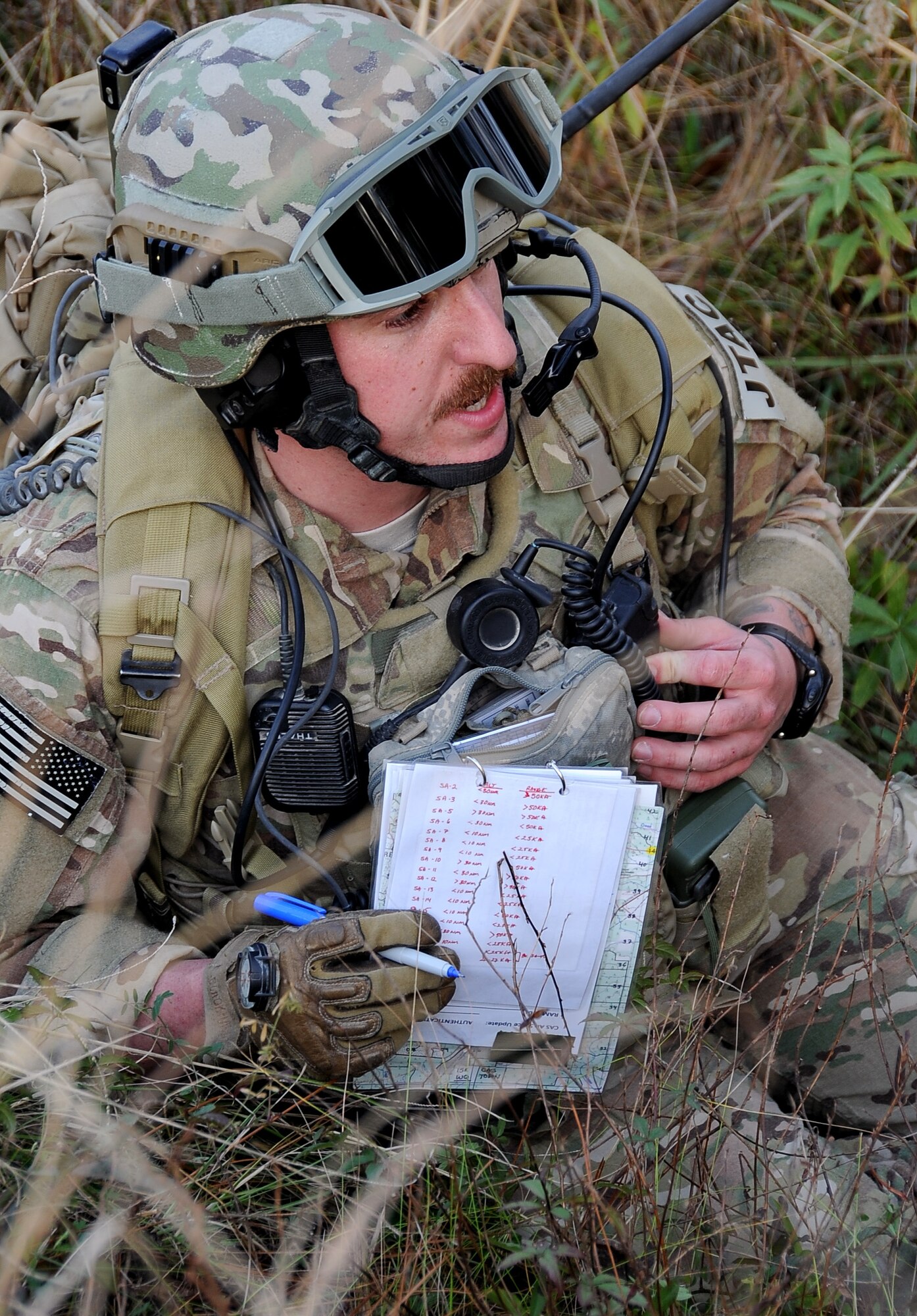 Staff Sgt. Michael McAndrew, 9th Air Support Operations Squadron, Ft. Hood, Texas, speaks over radio with the pilot in an F-16 Fighting Falcon flying overhead during Green Flag East 13-03 in Leesville, La., Jan. 21. McAndrew, along with 5 other Joint Terminal Air Controllers made up a Tactical Air Control Party and interacted with F-16 pilots, from Shaw Air Force Base, S.C., who provided close air support and the ability to take out any systems or adversaries trying to prevent the movement of the TACP. (U.S. Air Force photo/Staff Sgt. Amber Ashcraft)