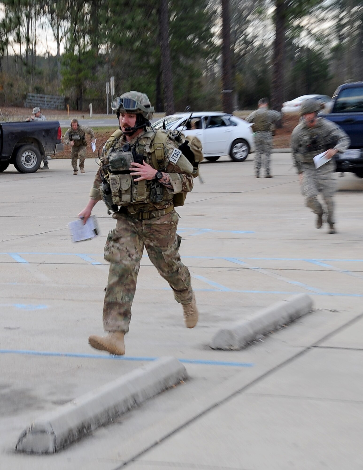 Staff Sgt. Michael McAndrew, 9th Air Support Operations Squadron, Ft. Hood, Texas, runs for cover as his fellow Joint Terminal Air Controllers follow during Green Flag East 13-03 in Leesville, La., Jan. 21. The JTACs made up a Tactical Air Control Party and interacted with F-16 Fighting Falcon pilots, from Shaw Air Force Base, S.C., who provided close air support and the ability to take out any systems or adversaries trying to prevent the movement of the TACP. (U.S. Air Force photo/Staff Sgt. Amber Ashcraft)