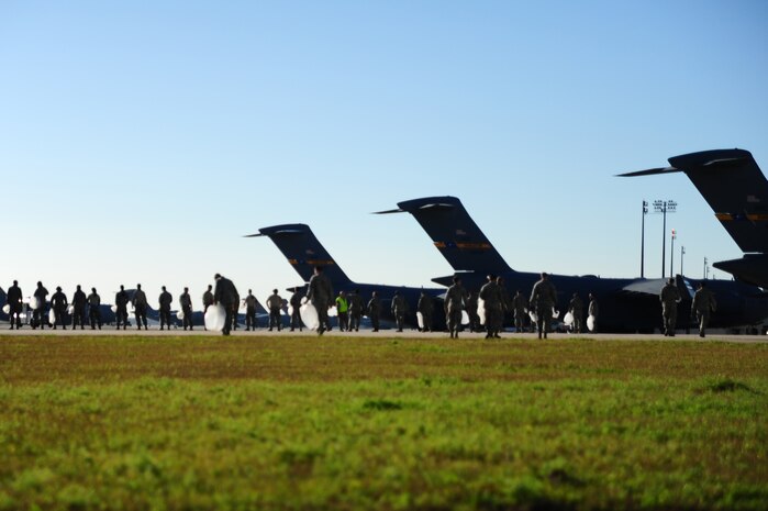 Joint Base Charleston Airmen search for Foreign Object Debris during a FOD Walk Jan. 17, 2013, at JB Charleston - Air Base, S.C. By removing FOD from runways and flightlines, Airmen help save the Air Force potentially millions of dollars in costly engine repairs and replacement every year.  (U.S. Air Force photo/ Airman 1st Class Chacarra Walker)