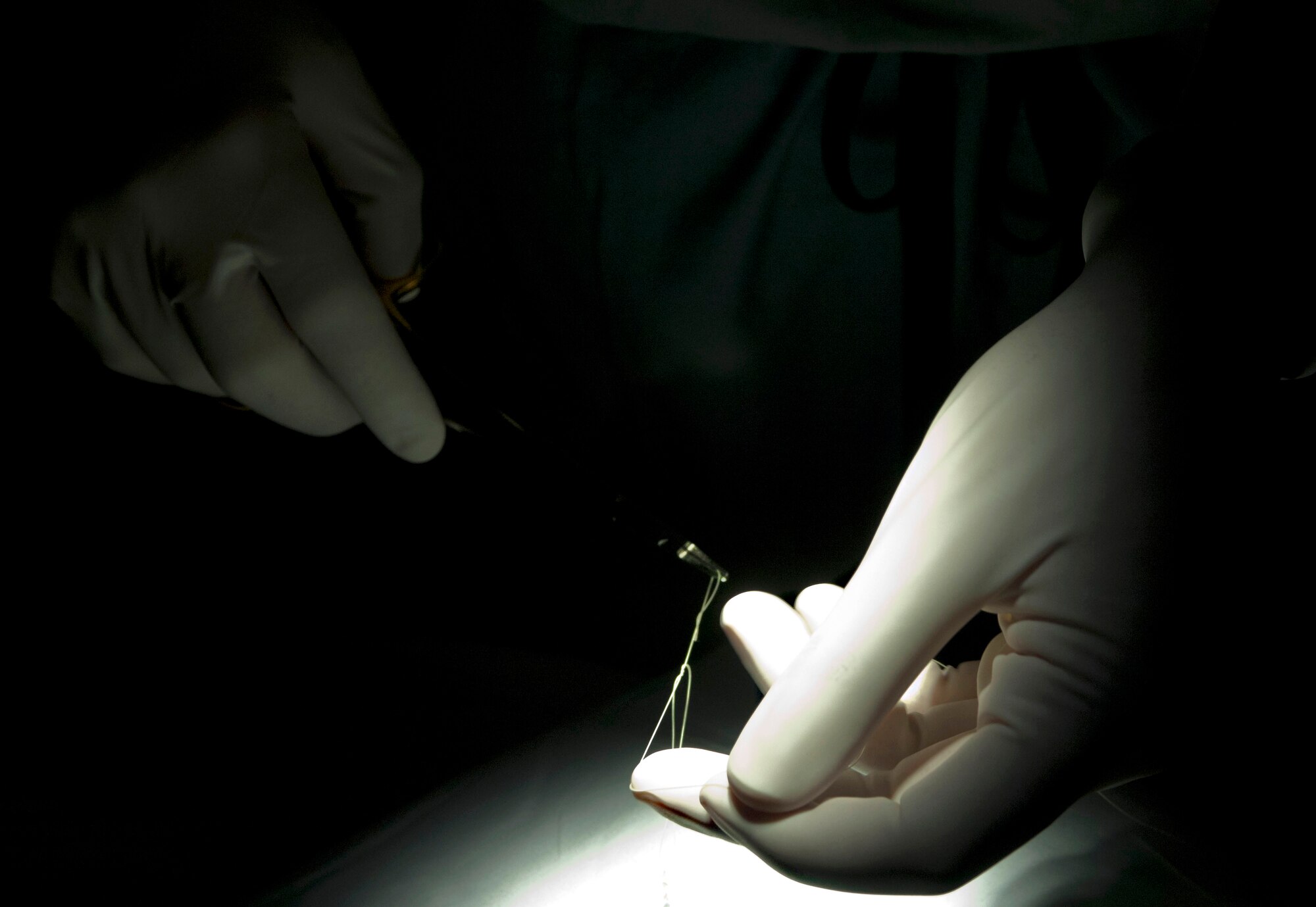 Dr. [Maj.] Gary Weissenfluh, 633rd Surgical Operations Squadron general surgeon, practices suturing Jan. 17, 2013, at U.S. Langley Hospital Langley multiservice clinic, Langley Air Force Base, Va. The clinic is located on the second floor of the hospital annex building and boasts Orthopedic, Otolaryngology, Oral Surgery, Urology, Gastroenterology, Cardiology and General Surgery services in one area. (U.S. Air Force photo by Airman 1st Class R. Alex Durbin/Released)