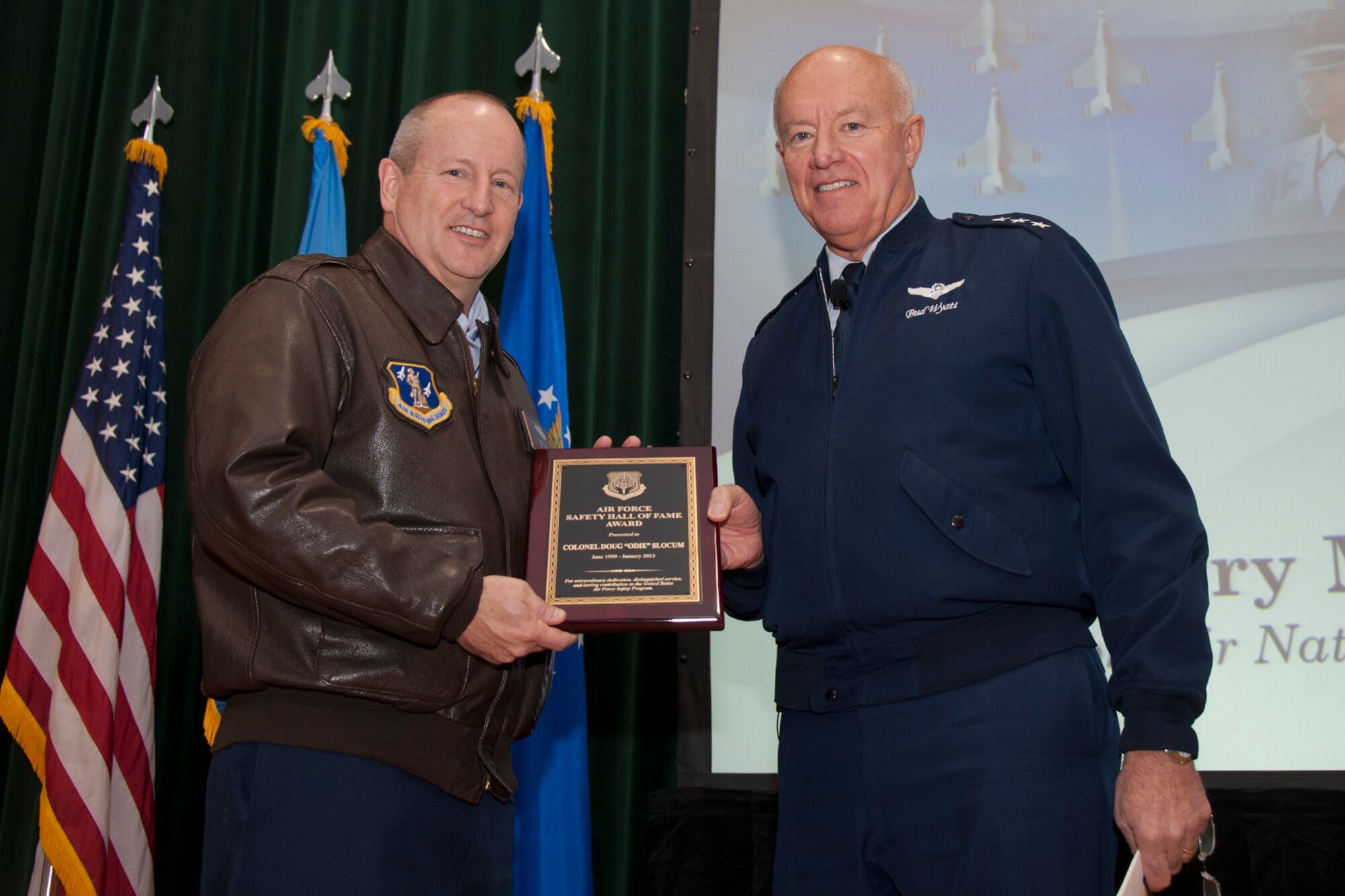 (JOINT BASE ANDREWS, Md.)  - U.S. Air Force Lt Gen Harry M. Wyatt, III of Oklahoma, right, presents US Air Force Safety Hall of Fame plaque to US Air Force Col Doug “Odie” Slocum, of Tucson, AZ  at an Air National Guard Town Hall meeting, January 22, 2103. (U.S. Air Force photo by Master Sgt. Marvin Preston/RELEASED)