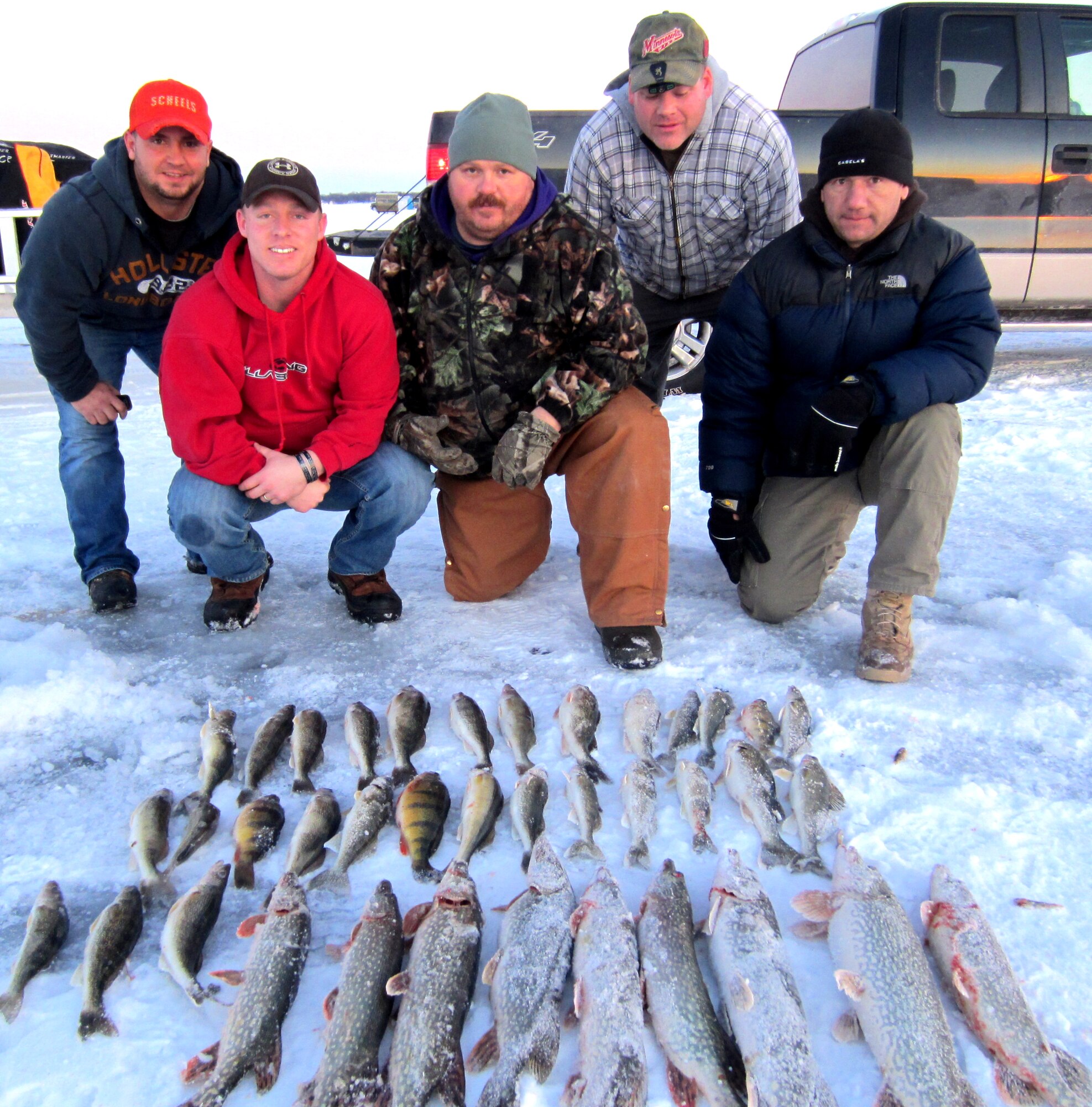 Veterans and guides present their catch Jan. 5, 2013, after completing a three-day ice fishing tournament hosted by the Wounded Warriors Guide Service in Devils Lake, N.D. The WWGS is cost-free guide service founded by veterans that provides hunting and fishing opportunities for disabled veterans. (Courtesy photo)