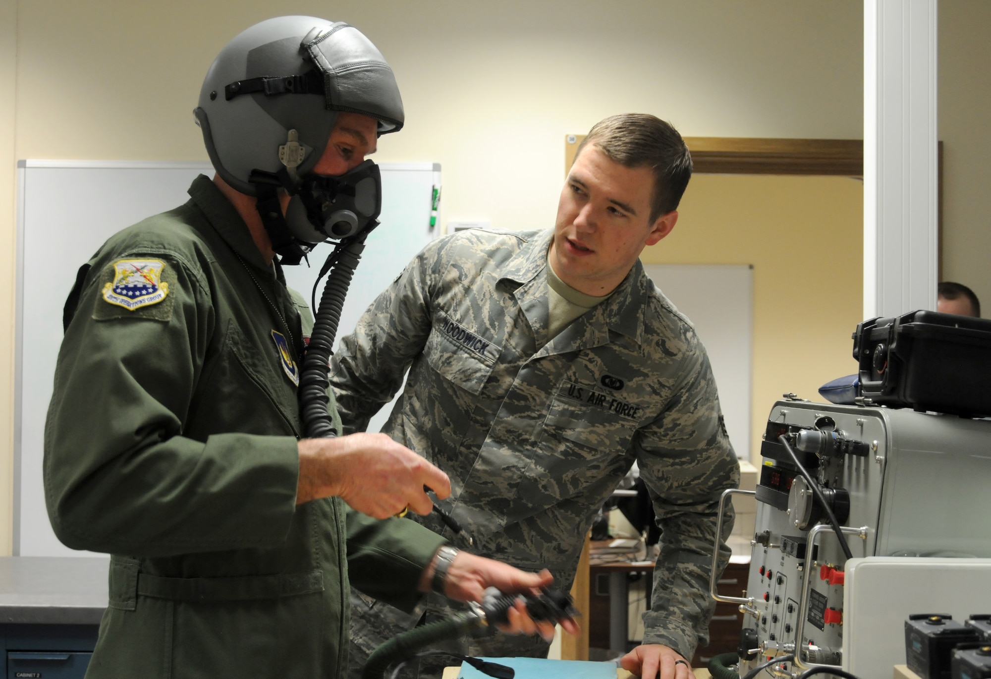 Senior Airman Tyler Woodwick, 48th Operations Support Squadron aircrew flight equipment journeyman from Belgrade, Mont., checks Chief Master Sgt. Christopher Powell’s, 100th Air Refueling Wing command chief from Cypress Fairbanks, Texas, flight helmet for air leaks Jan. 15, 2013, in preparation for an incentive flight at RAF Lakenheath, England. Powell, who earned the flight for his nearly 30 years of service, flew aboard an F-15 Strike Eagle aircraft from the 493rd Fighter Squadron Jan. 18, 2013, after several days of delays due to the weather. (U.S. Air Force photo by Tech. Sgt. Neal X. Joiner/Released)