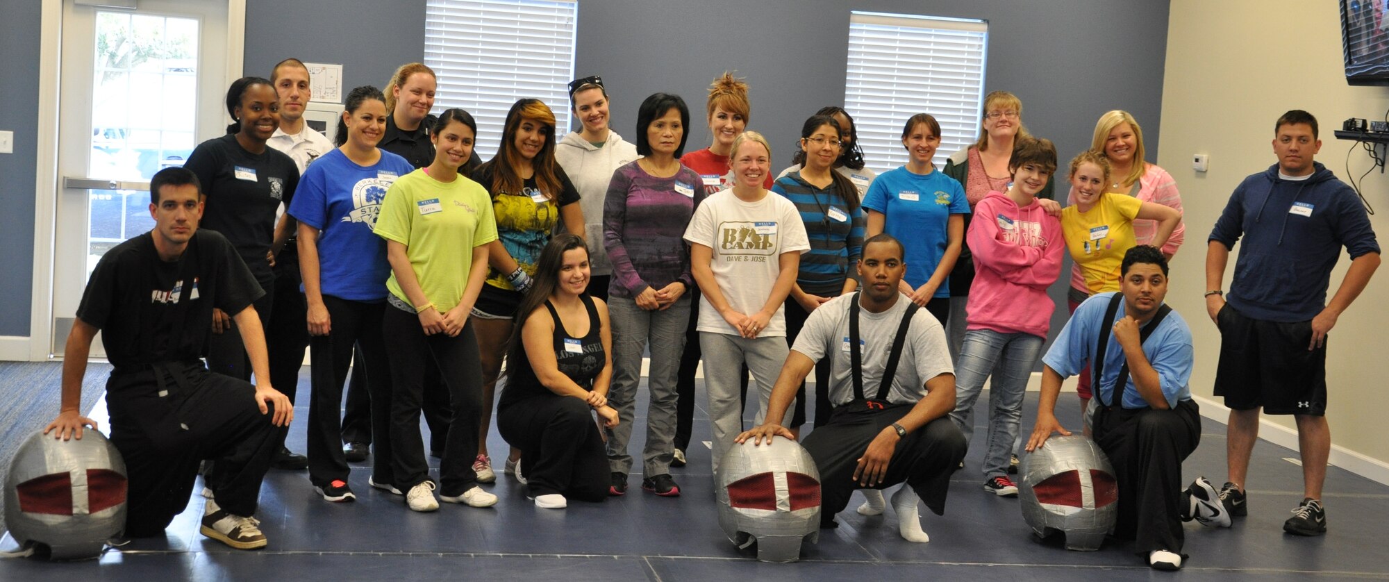 The first Fear Adrenaline Stress Training class of 2013 pose for a photo Jan. 19 at the Balfour Beatty Community Center. The class is for women 14-years-old and older, which teaches them how to defend themselves in fearful and stressful situations. (U.S. Air Force photo by Senior Airman Christopher Reel) 