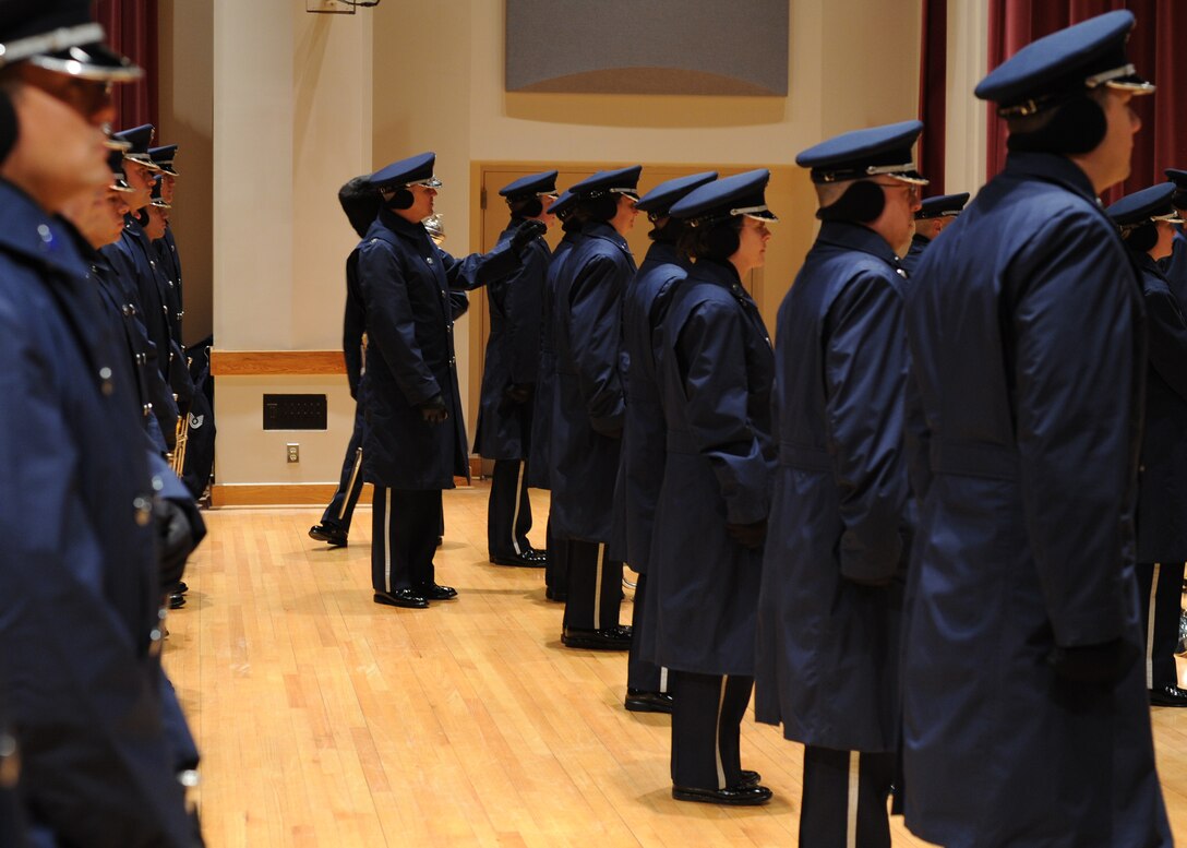 Col. Larry Lang, U.S. Air Force Band commander, makes a correction on a bandsman’s uniform during an inspection on Joint Base Anacostia-Bolling prior to the inauguration Jan. 21. This was the band’s 16th inaugural parade. (U.S. Air Force photo/Senior Airman Bahja Joi Jones))