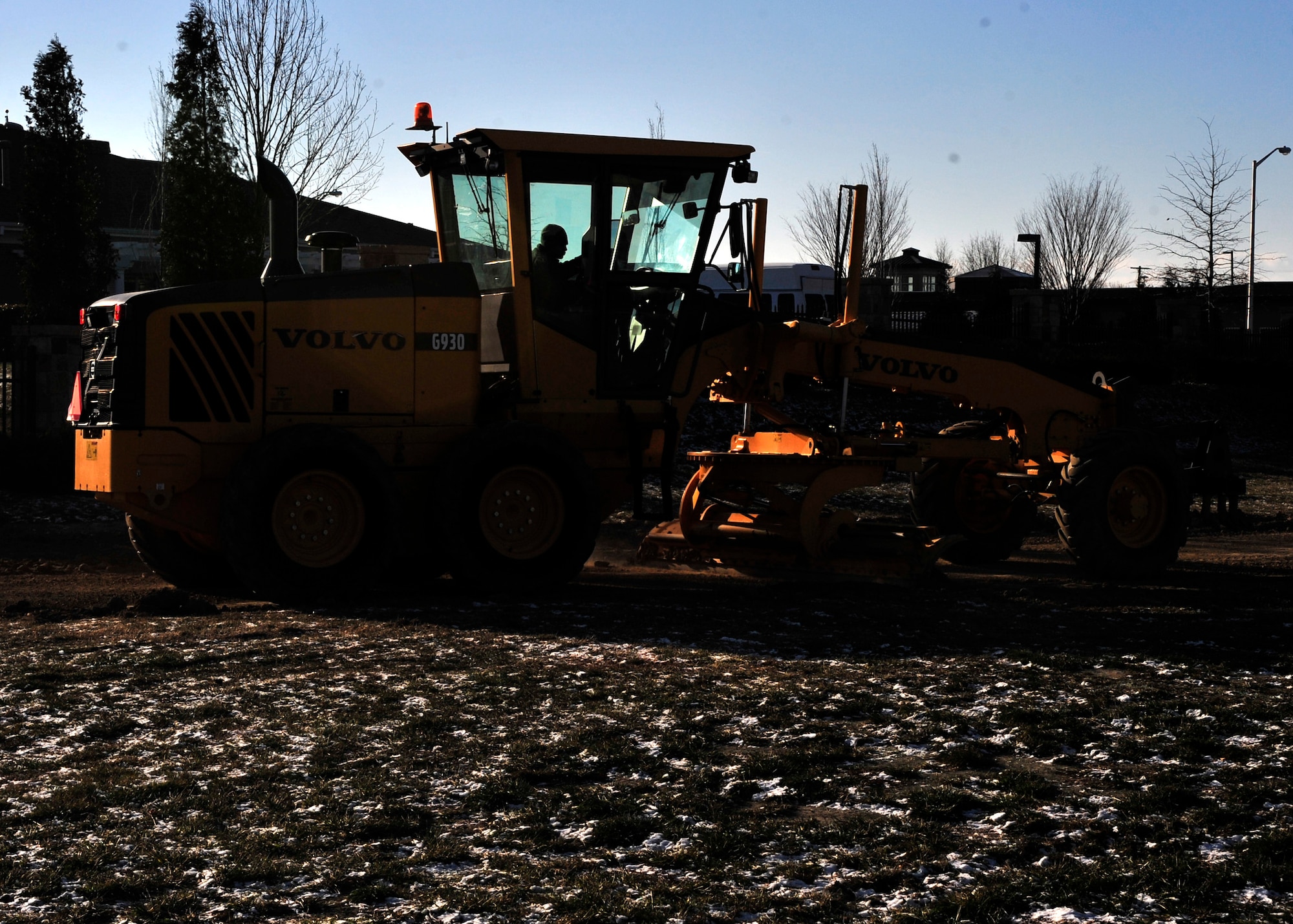 Senior Airman Cesar Salas, 436th Civil Engineer Squadron, uses a motor grader to level a field that is being turned into a parking lot Jan. 23, 2013, at Dover Air Force Base, Del. Due to a recent change in their career field, the 436th CES personnel have taken steps to transform their mission capabilities. (U.S. Air Force photo by Tech. Sgt. Chuck Walker)