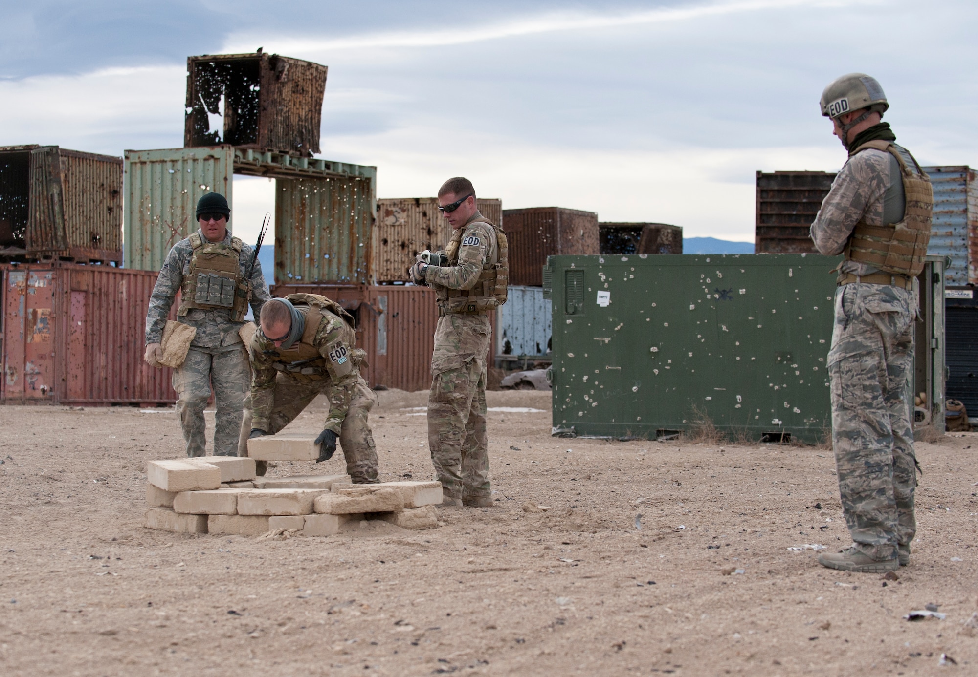 FORT CARSON, Colo. -- Staff Sgt. Jeremy Redfern, 21st Civil Engineer Squadron EOD technician, and his team prepare an area for the controlled detonation of recovered unexploded ordnance during a training exercise Jan. 10 at Fort Carson. Exercises like this are designed to expose Airmen to the physical and mental fatigue experienced while deployed. The Airmen from the 21st EOD flight use the training learned in these exercises to fulfill their role as a defensive force at home and while deployed. (U.S. Air Force photo/Staff Sgt. J. Aaron Breeden)