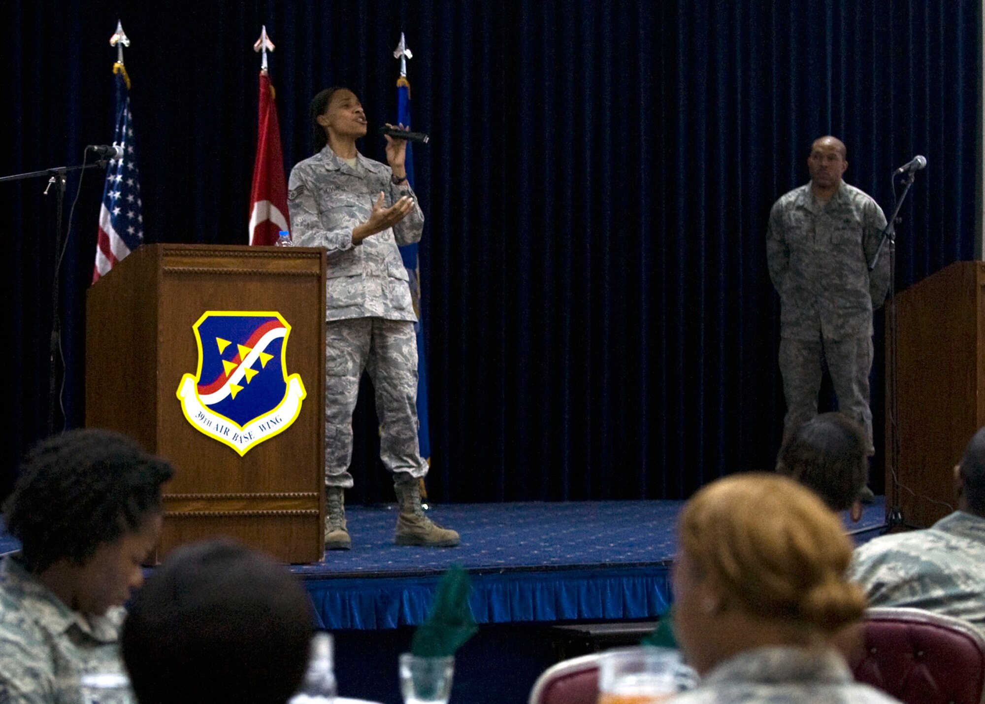 Staff Sgt. Melissa Howard, 39th Medical Support Squadron ultrasound technician, sings “Never Give Up” during the Honoring the Dream ceremony in honor of Dr. Martin Luther King Jan. 18, 2013, at Incirlik Air Base, Turkey. The ceremony was held to honor the contributions of Dr. King to the civil rights movement and to celebrate the progress made since his famous “I Have a Dream” speech in 1963. (U.S. Air Force photo by Staff Sgt. Marissa Tucker/Released)
