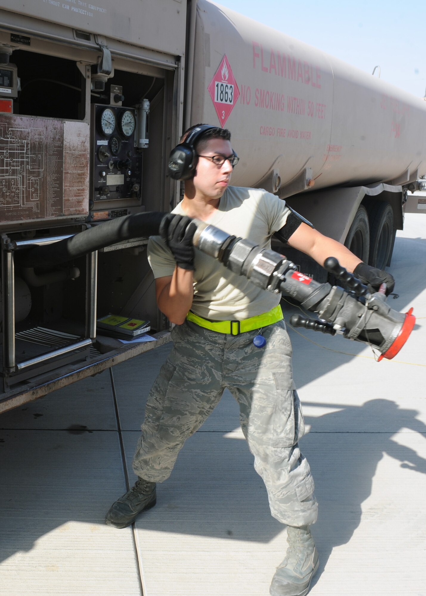 SOUTHWEST ASIA – Airman 1st Class Hugo Delgado, 379th Expeditionary Logistics Readiness Squadron fuels distribution operator, prepares to fuel a KC-135 from his fuel truck Jan. 22. The average fuels operator will spend nearly half a day on the flight line. Delgado is deployed from the 18th Logistics Readiness Squadron at Kadena Air Base, Japan. (U.S. Air Force photo/Senior Airman Joel Mease)