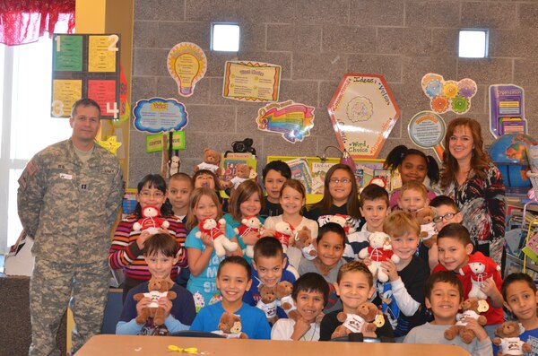 RIO RANCHO, N.M., -- On Jan. 13, Capt. John Deal  visited  Ms. Tracy Lewis’ third grade class at 7 Bar Elementary School to deliver some gifts. 