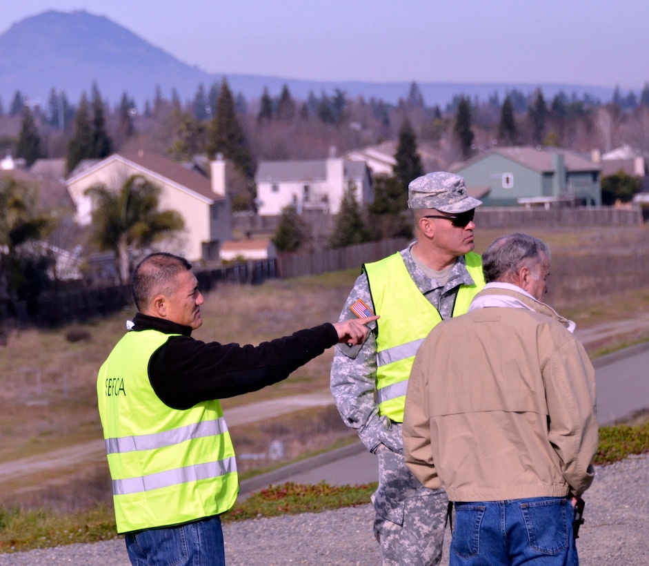 (From left to right) Mike Inamine, executive director for the Sutter Butte Flood Control Agency; Col. Bill Leady, commander of the U.S. Army Corps of Engineers Sacramento District; and Bill Hampton, manager of the Sutter County Levee District One, view the Feather River near Shanghai Bend in Yuba City, Calif. Jan. 22, 2013. Shanghai Bend was the site of a catastrophic levee break in 1955 when Yuba City flooded and 38 residents died. Leady and the representatives toured the site of the proposed Feather River West Levee Project in Yuba City during the visit. This SBFCA project aims to provide 200-year flood protection for Biggs, Gridley, Live Oak and Yuba City plus 100-year flood protection for the rural area of the river basin south of the four townships. (U.S. Army photo by Robert Kidd/Released)