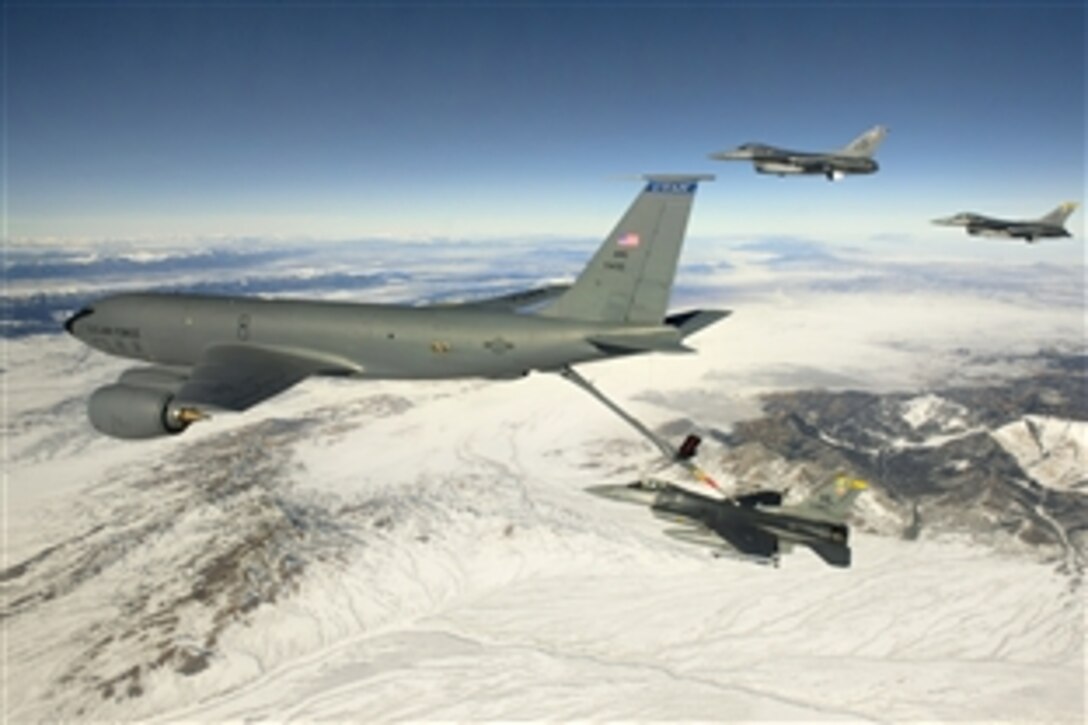 Air Force Capt. Jared White flies an F-16 Fighting Falcon as it receives fuel from a KC-135 tanker en route to San Diego, Jan. 18, 2013. White is assigned to the 421st Fighter Squadron, Hill Air Force Base, Utah. The tanker is assigned to the Utah National Guard.