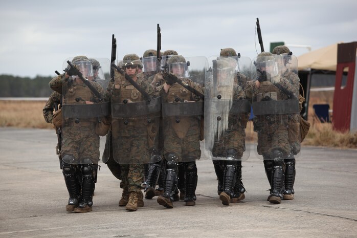 Marines with Easy Company, Black Sea Rotational Force 13, march to the front of the embassy preparing for the next scenario. Marines and sailors with Easy Company, and the 2013 iteration of BSRF conducted their first embassy reinforcement mission rehearsal exercise the week of January 7. 