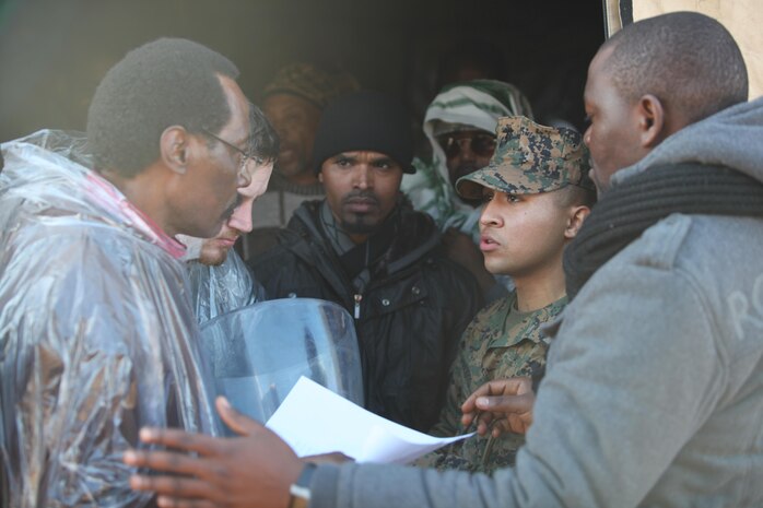 Sgt. Johnny Navarro, the non-commissioned officer in charge of the Black Sea Rotational Force 13’s administration section, checks in mock evacuees and directs them to their mock living quarters. Marines and sailors with the 2013 iteration of BSRF conducted their first noncombatant evacuation mission rehearsal exercise the week of January 7. 
