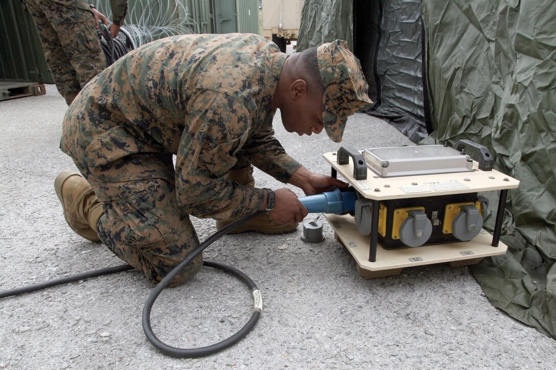 Pfc. Shawn H. Duncan assembles a power source for a communications exercise site Jan. 16 at Camp Foster. The purpose of the exercise is to prepare the Marines of Combat Logistics Battalion 4 for future operations throughout the Asia-Pacific region. Duncan is an electrician with CLB-4, Combat Logistics Regiment 3, 3rd Marine Logistics Group, III Marine Expeditionary Force.