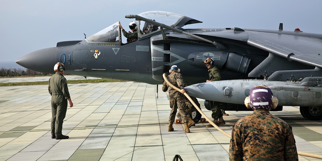 Bulk fuel specialists refuel an AV-8B Harrier during bulk refueling training Jan. 16 at Ie Shima training facility. The squadron is preparing for various operations and exercises in  support of the 31st Marine Expeditionary Unit. The bulk fuel specialists are with Marine Wing Support Squadron 172, Marine Aircraft Group 36, 1st Marine Aircraft Wing, III Marine Expeditionary Force. The aircraft is with Marine Attack Squadron 513 which is currently attached to Marine Medium Helicopter Squadron 262, 1st MAW, III MEF. 