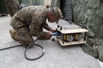 Pfc. Shawn H. Duncan assembles a power source for a communications exercise site Jan. 16 at Camp Foster. The purpose of the exercise is to prepare the Marines of Combat Logistics Battalion 4 for future operations throughout the Asia-Pacific region. Duncan is an electrician with CLB-4, Combat Logistics Regiment 3, 3rd Marine Logistics Group, III Marine Expeditionary Force. 
