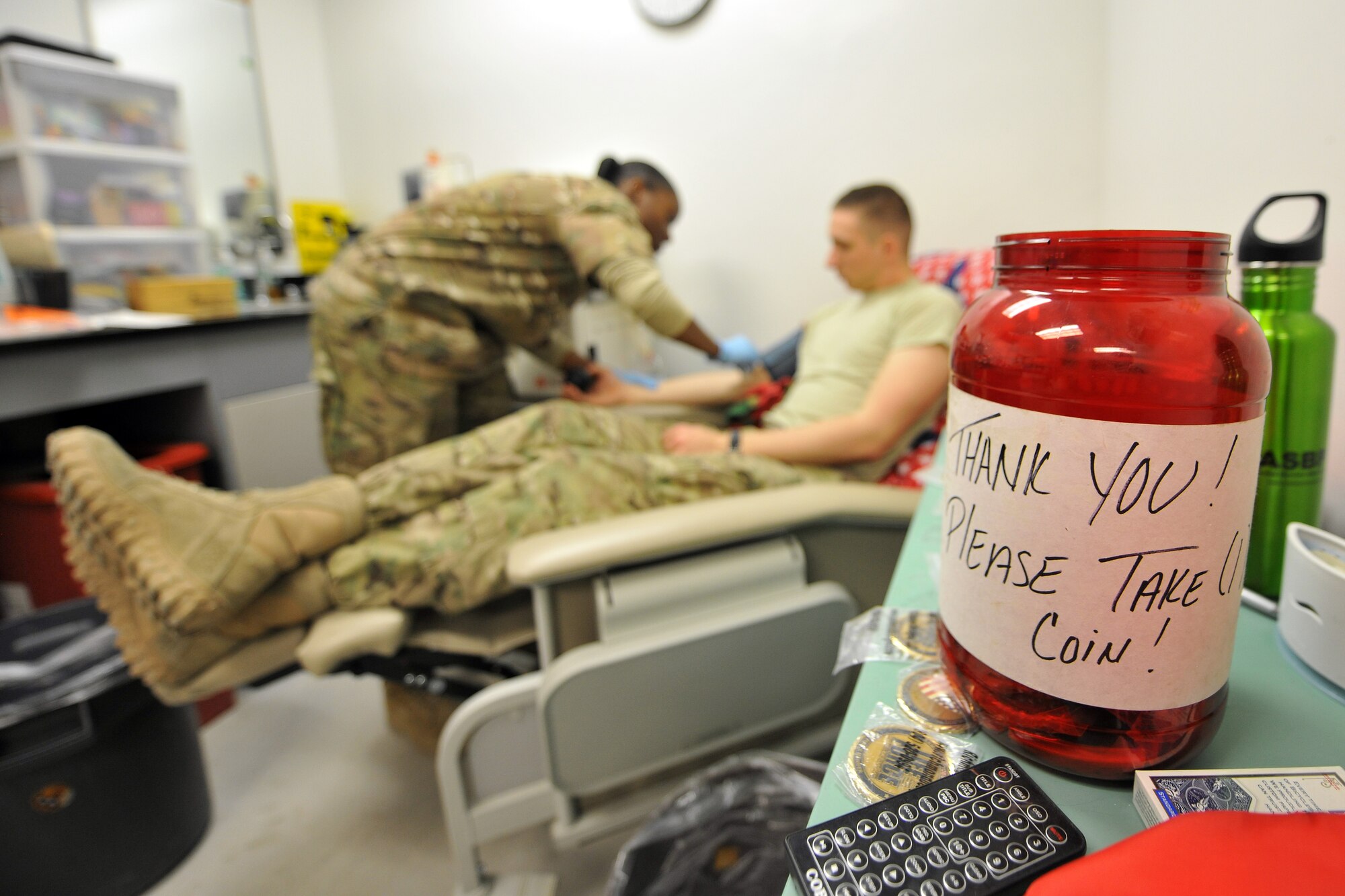 U.S. Army Sgt. Tahera Parker, 432nd Blood Support Detachment laboratory technician, draws blood platelets from Spc. Paul Bizzoco, 582nd Medical Logistics Company, at the Craig Joint Theater Hospital on Bagram Airfield, Afghanistan, Jan. 24, 2013.  The 432nd BSD is responsible for supplying blood products throughout Afghanistan.  (U.S. Air Force photo/Senior Airman Chris Willis)