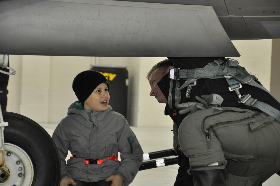 MacAidan “Mac” Gallegos, conducts a walk around inspection of an F-22 with Lt. Col. Brian Baldwin, a Reserve F-22 pilot assigned to the 302nd FS prior to his flight. Mac wrote a letter to his father Army Sgt. Justin Gallegos who was killed in Afghanistan in 2009 and wanted it to be flown as close to heaven as possible on his fathers birthday. Gallegos died when enemy forces equipped with small arms and rocket-propelled grenades swarmed a pair of remote outposts in the Kamdesh district of Nuristan province. He was part of a group serving there with the 3rd Squadron, 61st Cavalry Regiment, 4th Brigade Combat Team, 4th Infantry Division out of Fort Carson, Colo. Mac’s mother originally from Palmer Alaska moved back to Anchorage in 2010. (U.S. Air Force Reserve Photo/Tech. Sgt. Dana Rosso) 